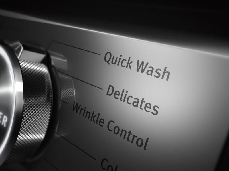 Washer control showing a Delicates program in the Maytag guide.