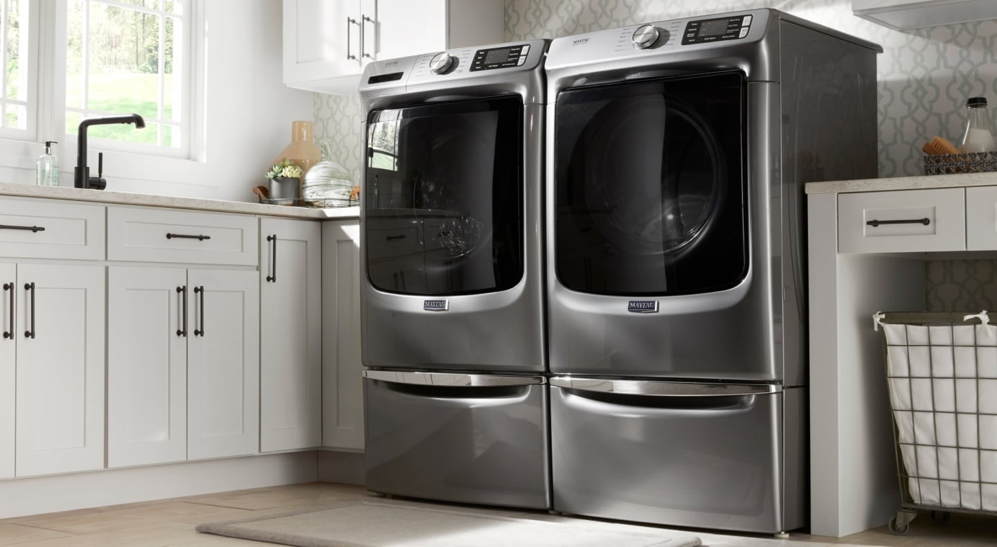 A washer and dryer pair pictured in the source shrinkage-prevention guide.
