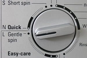 A washer control with a Gentle spin setting, pictured in the source acetate-care guide.