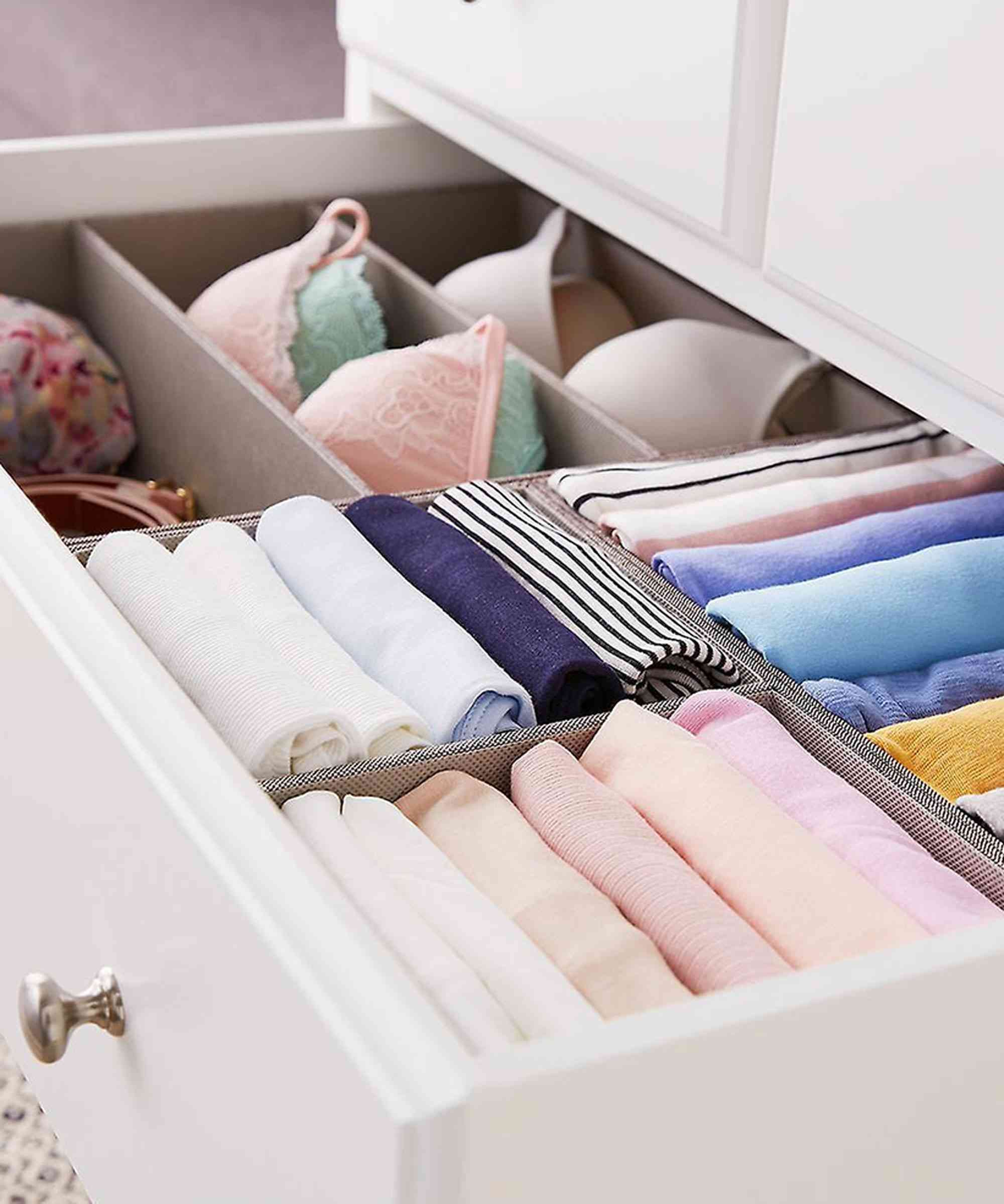 Folded and separated clothing arranged in a drawer in the source long-term storage guide.